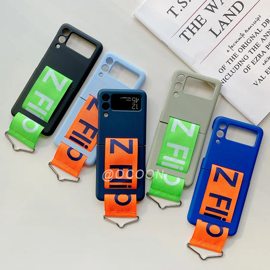 Fashion Hand Strap Phone Case For Samsung Galaxy Z Flip 6 5 4 ZFlip 3  Ultra Thin Hard Plastic Cover Wristband Ring Fundas Coque
